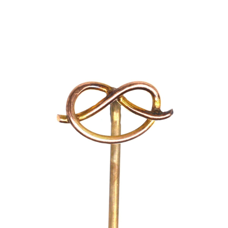 Edwardian 9ct gold Stafford Knot tie pin resembling a pretzel, dating back to 1900-1910, symbolizing love.