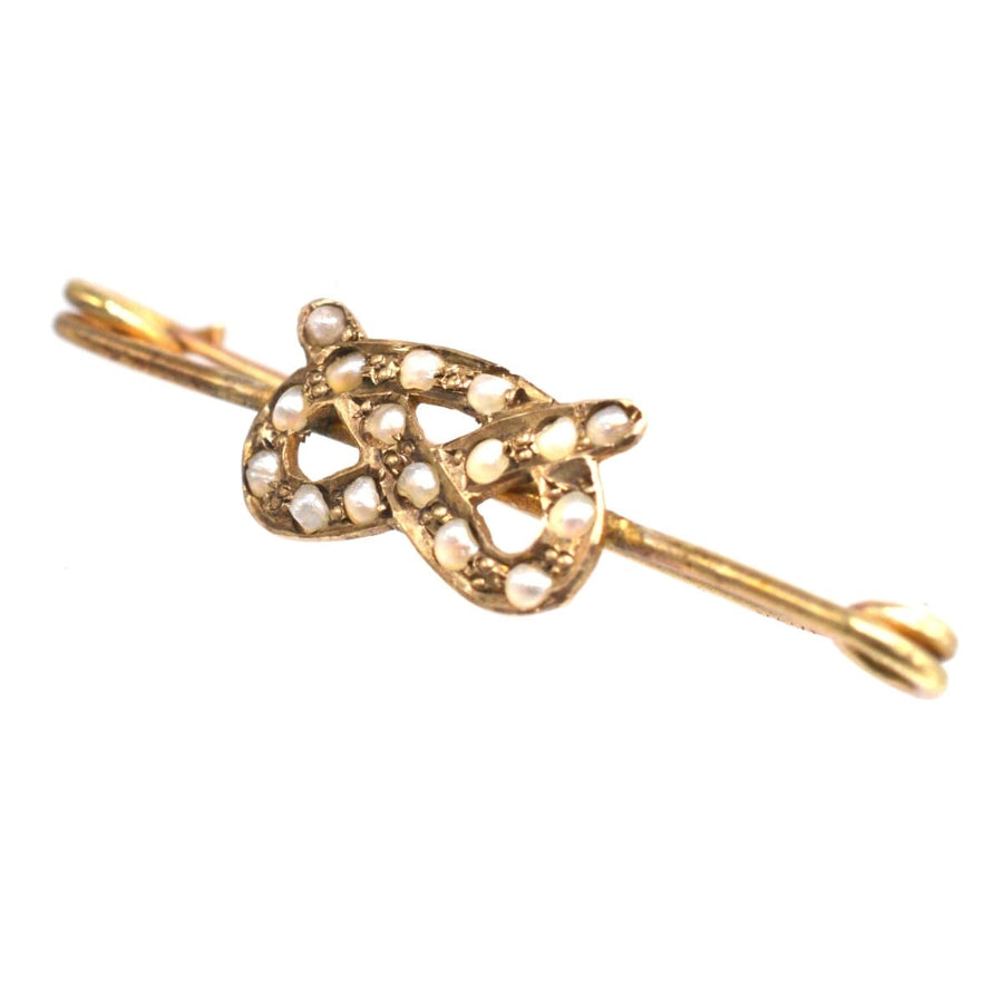 Edwardian 9ct gold Stafford Knot bar brooch with natural split pearls, symbolizing love and history.