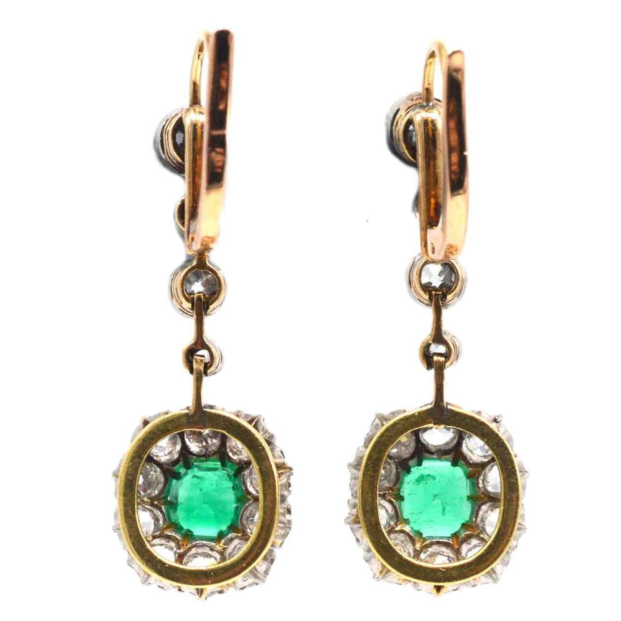 Edwardian emerald and diamond drop earrings set in 18ct gold and platinum, featuring vibrant Colombian emeralds.