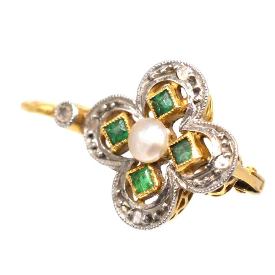 Edwardian quatrefoil earrings featuring emeralds, a pearl centerpiece, and diamond accents, perfect for any occasion.