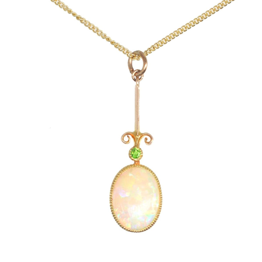 Edwardian opal and green garnet pendant on a modern 9ct gold chain, showcasing fine craftsmanship.