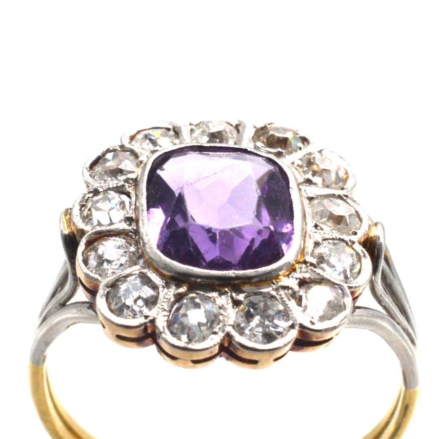 Edwardian platinum and gold amethyst diamond cluster ring with unique triple loop shoulders.