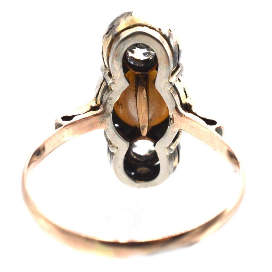 Edwardian silver and gold ring featuring old mine cut diamonds and a natural pearl, circa 1905.