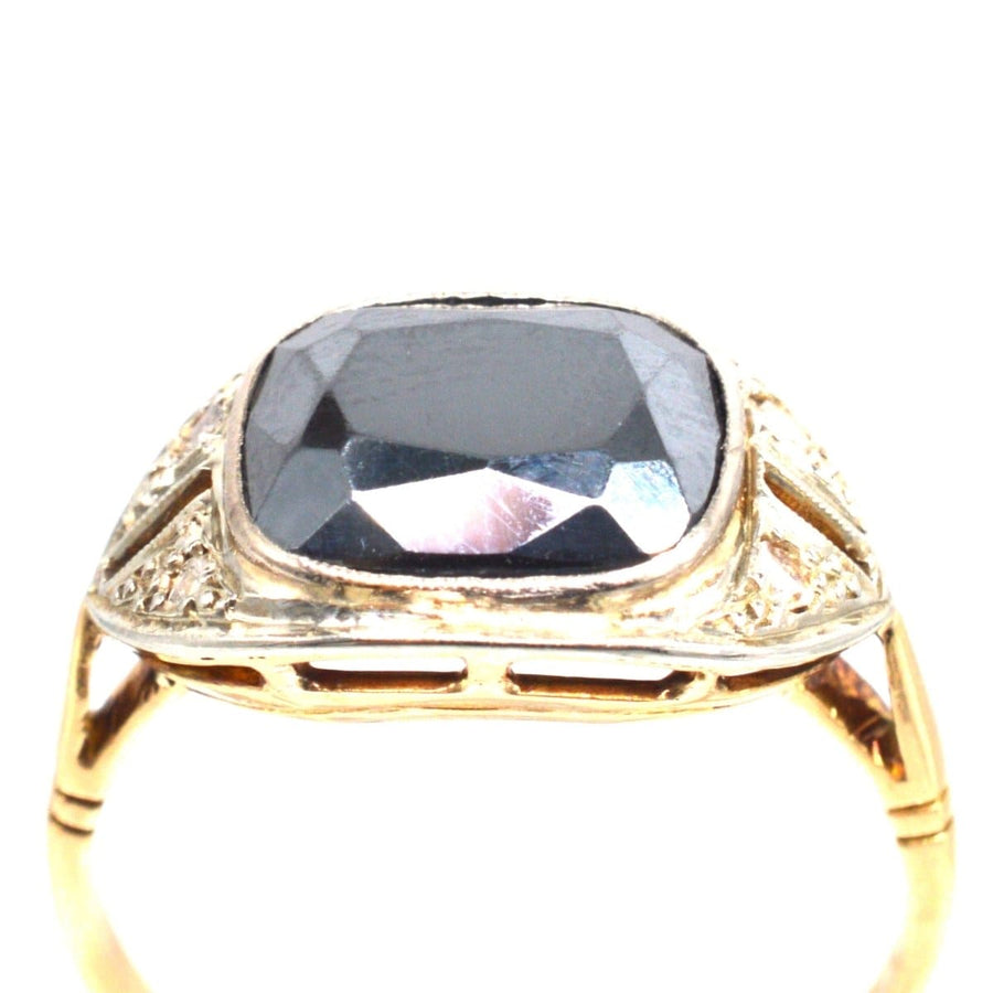 French Art Deco 18ct gold and platinum hematite and diamond ring, featuring a unique cushion-cut hematite.