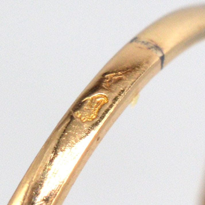 Close-up of inside band markings on a French Art Deco gold ring, showcasing craftsmanship and authenticity.
