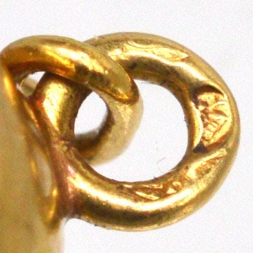 Close-up of a gold loop detail from elegant 18ct gold French Art Deco cufflinks.