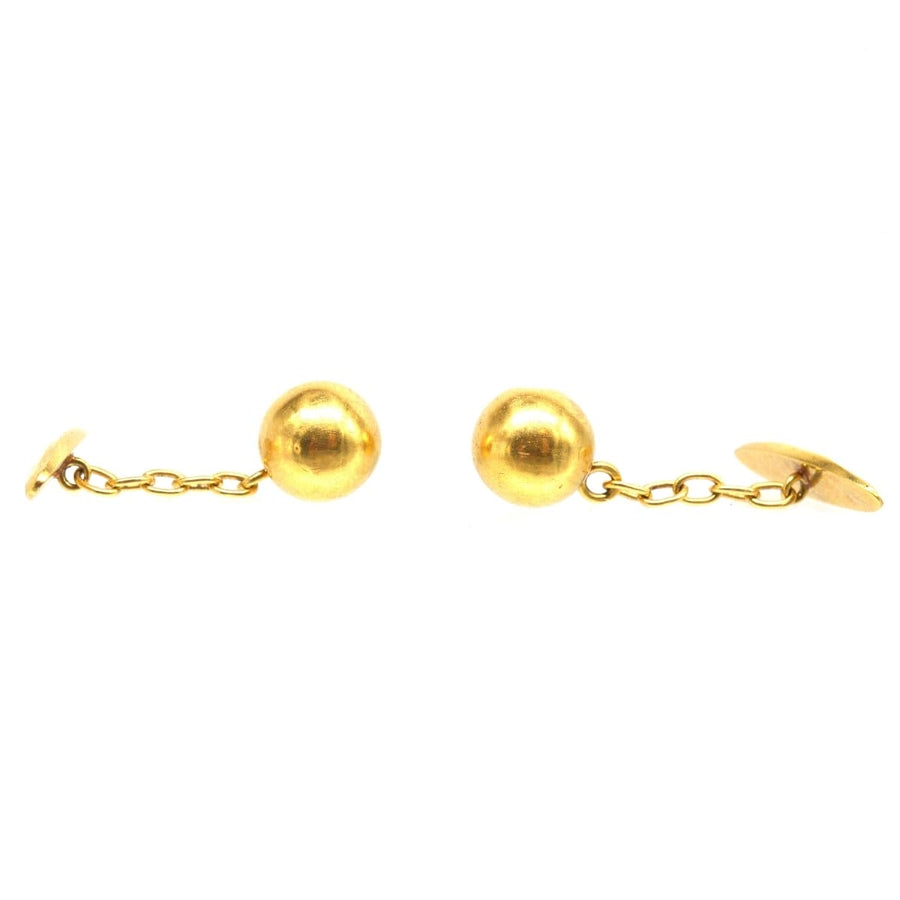 French Art Deco 18ct gold ball cufflinks with chain, elegant men's accessory from the 1920s.