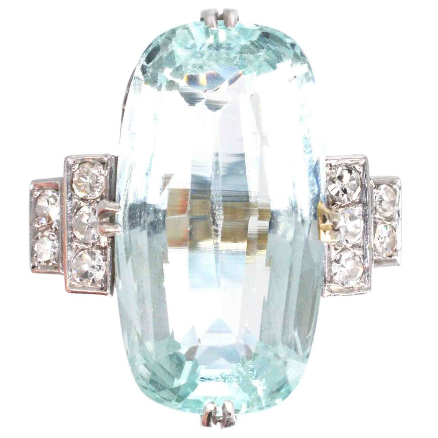 Art Deco platinum ring featuring a 12-carat aquamarine gemstone and sparkling diamond accents from the 1930s.