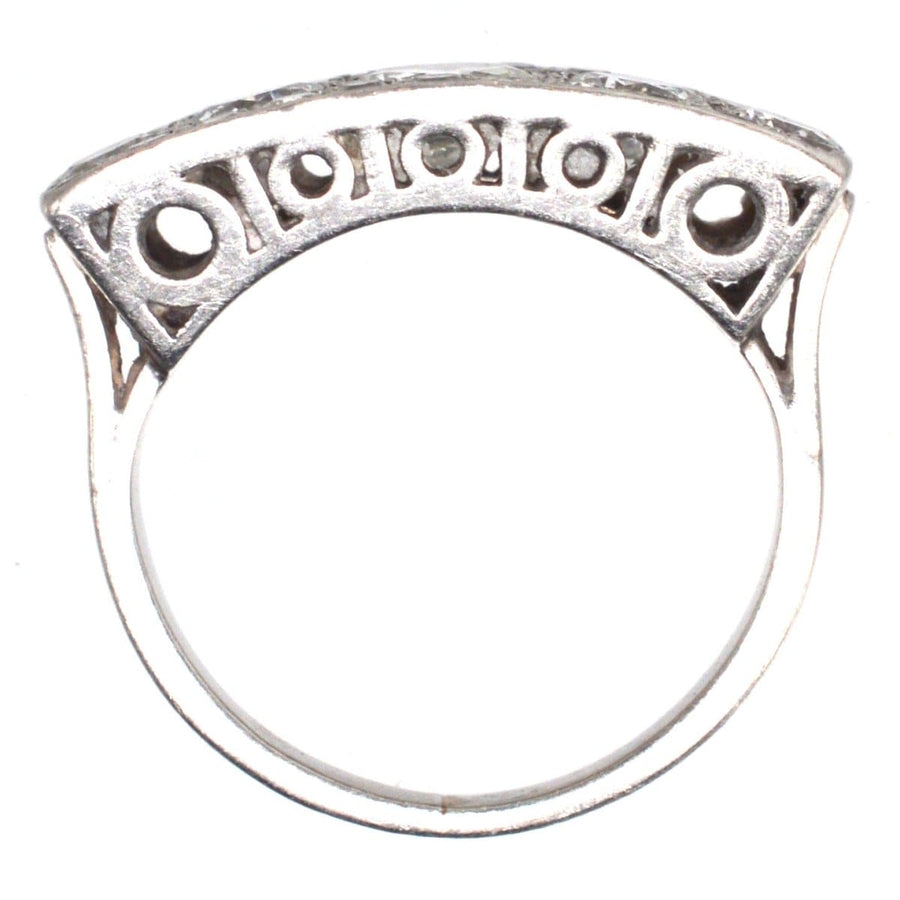 Art Deco platinum and diamond ring featuring intricate design and over 2 carats of sparkling diamonds.