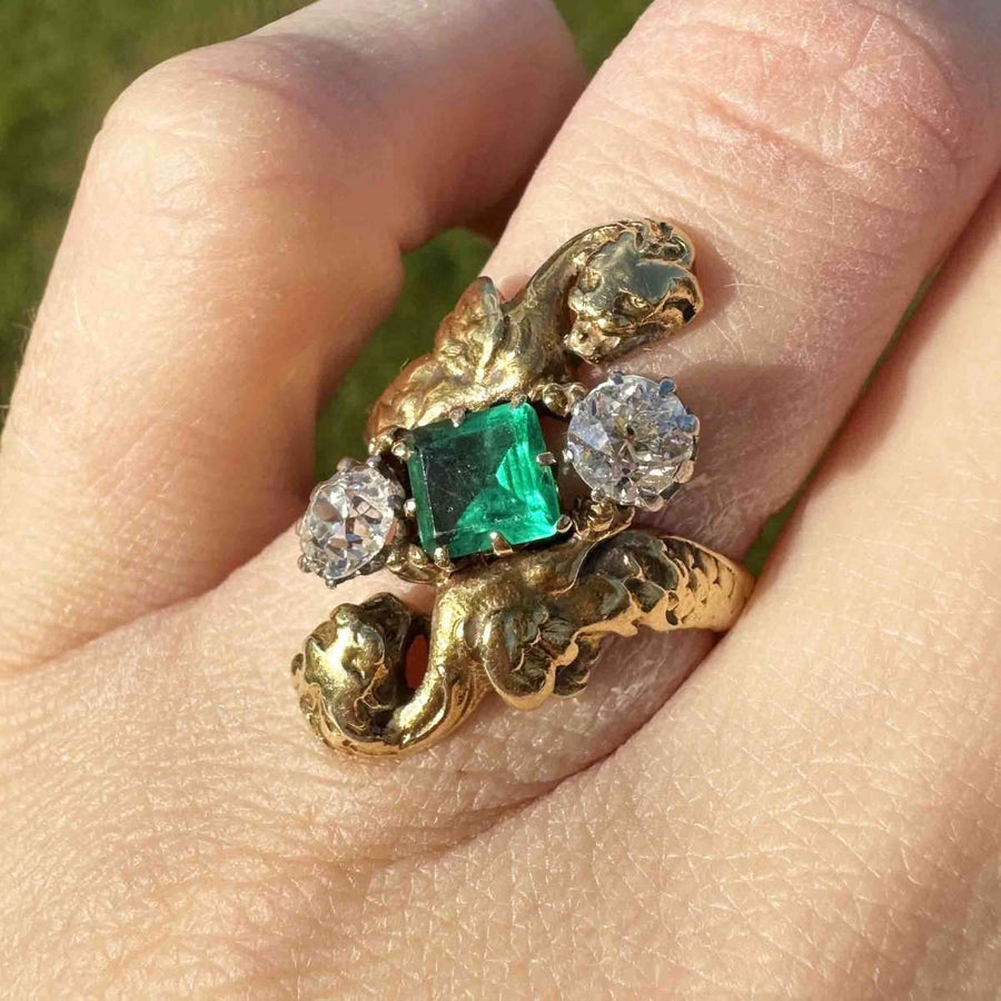 French Art Nouveau 18ct gold ring featuring a Colombian emerald and two old European cut diamonds.