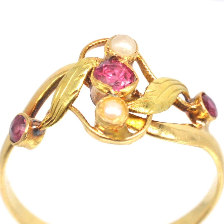French Art Nouveau 18ct gold ring with rubies and pearls in naturalistic leaf design.