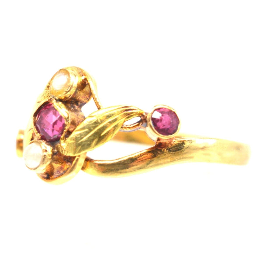 French Art Nouveau 18ct gold ring featuring three rubies and two pearls in a naturalistic design.
