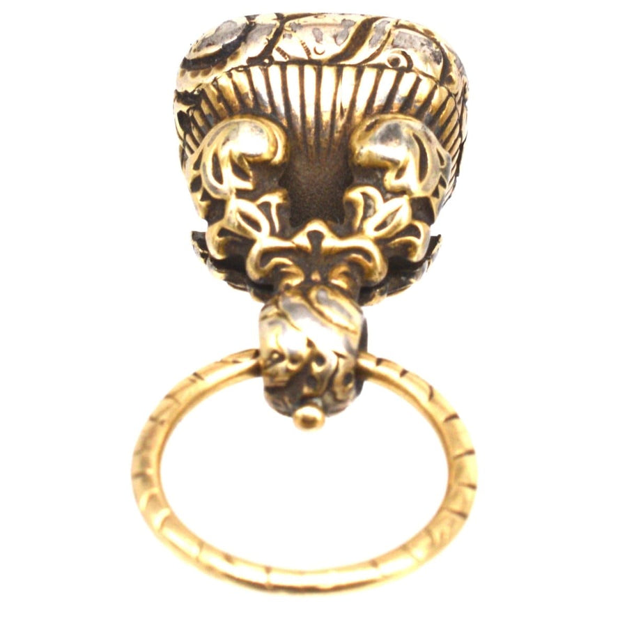 Late Georgian gold cased seal with decorative repousse work and split ring, featuring doves and the word LOVE.
