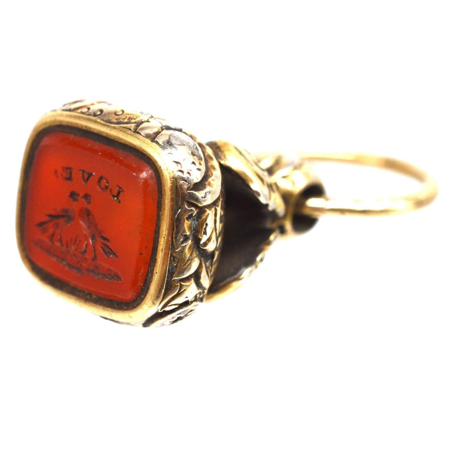 Georgian gold seal with carnelian intaglio showcasing two doves and 'LOVE' inscription, circa 1820s.
