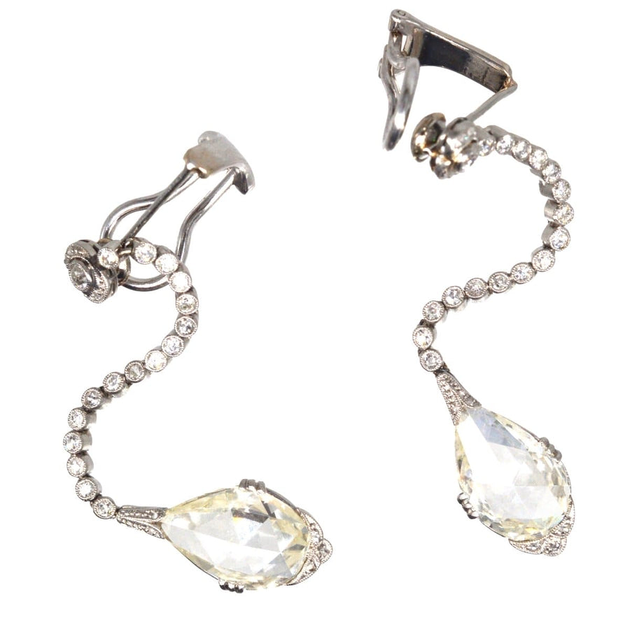 Large Edwardian platinum drop earrings featuring rose cut diamonds and intricate Art Nouveau design.