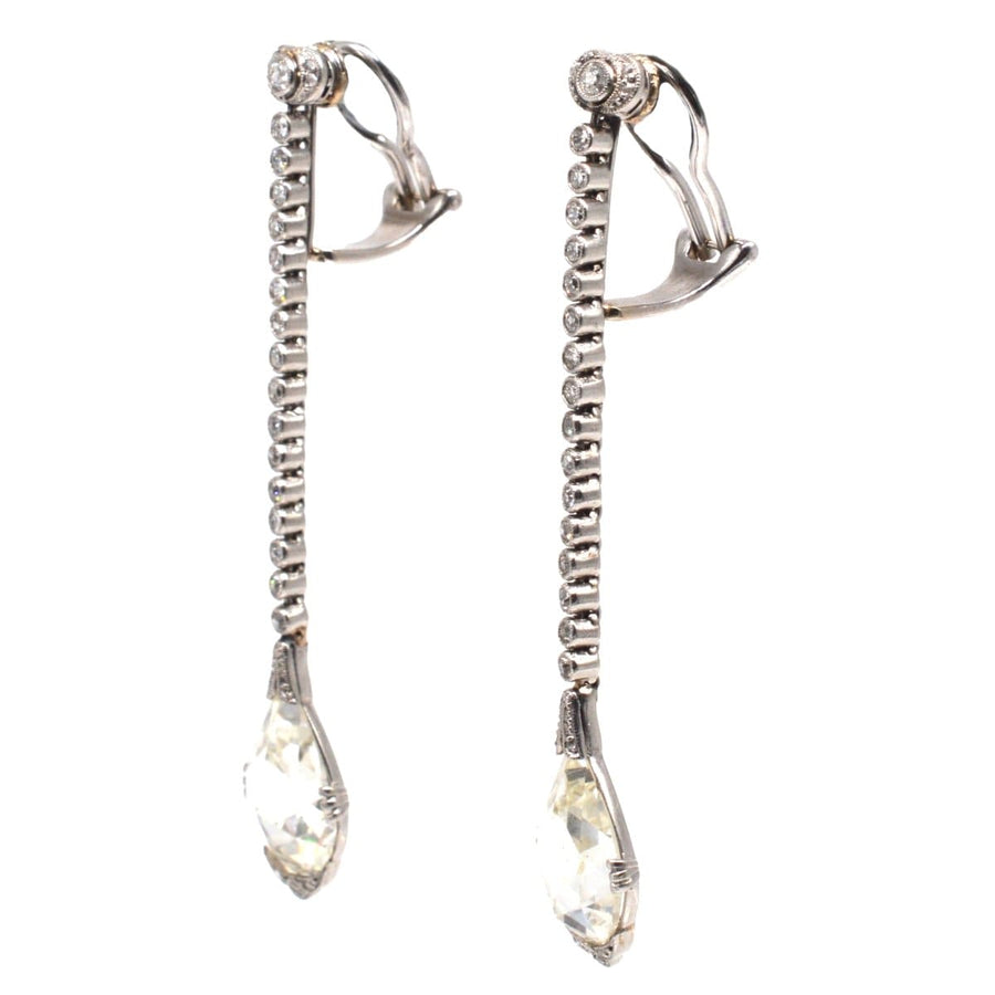 Large Edwardian platinum drop earrings featuring rose cut diamonds and elegant Art Nouveau design.