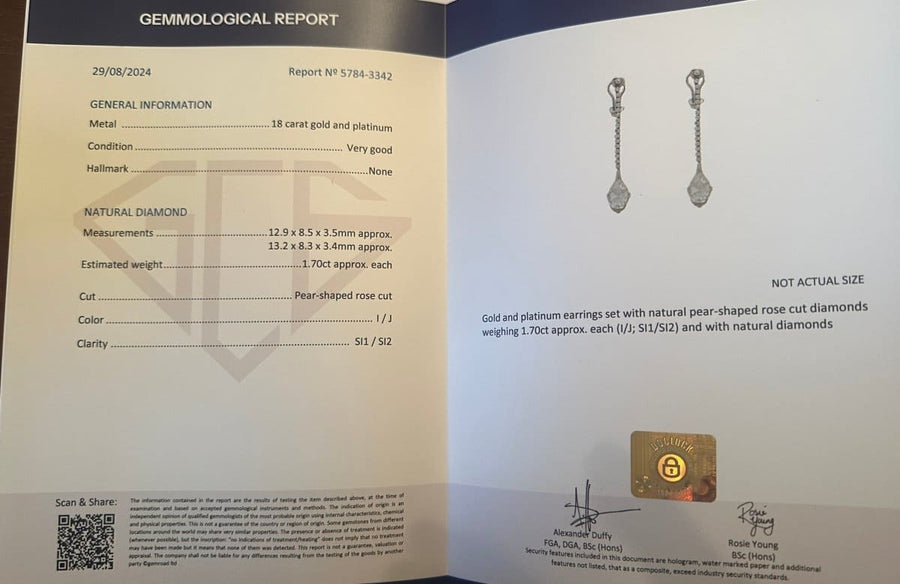 Gemology report for 18k gold and platinum earrings with natural pear-shaped diamonds.