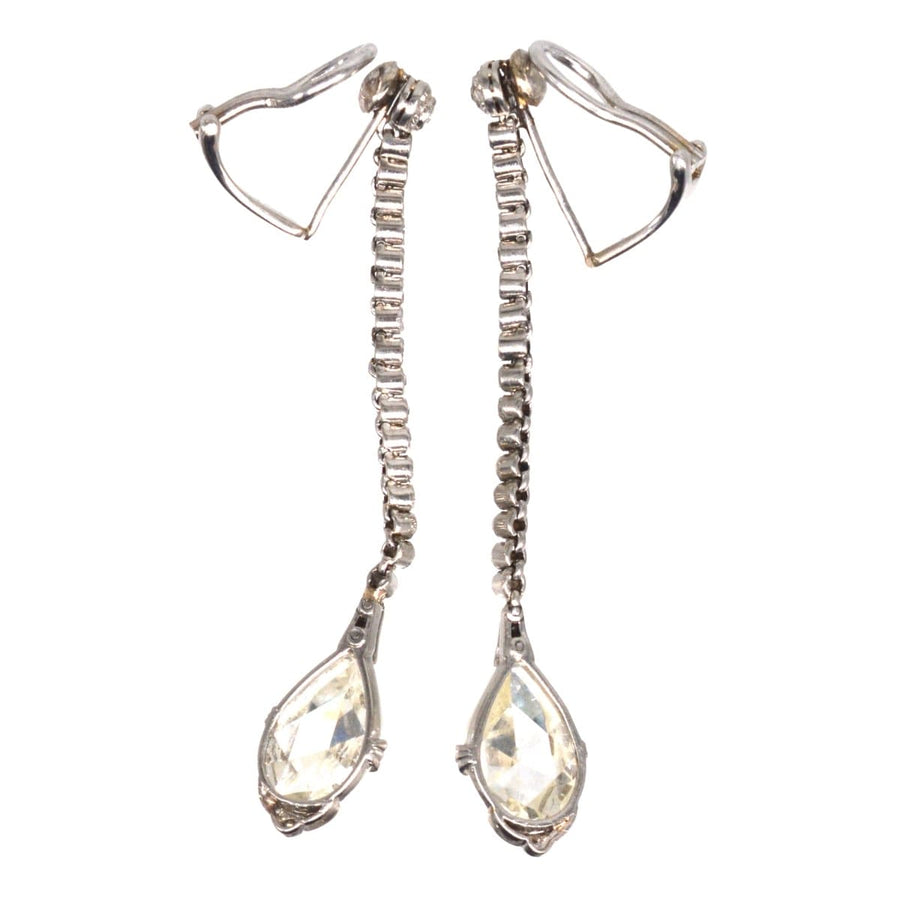 Elegant large Edwardian platinum drop earrings with rose cut diamonds and intricate detailing.