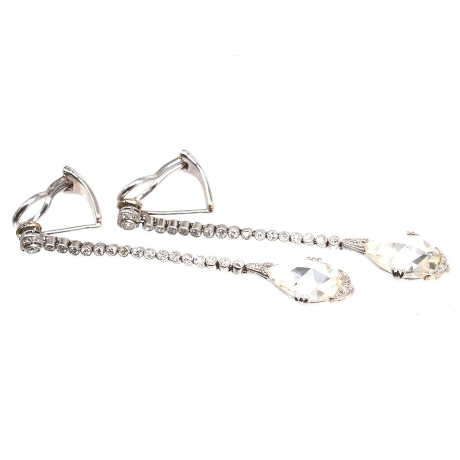 Large Edwardian platinum drop clip-on earrings featuring rose cut diamonds and elegant chains.
