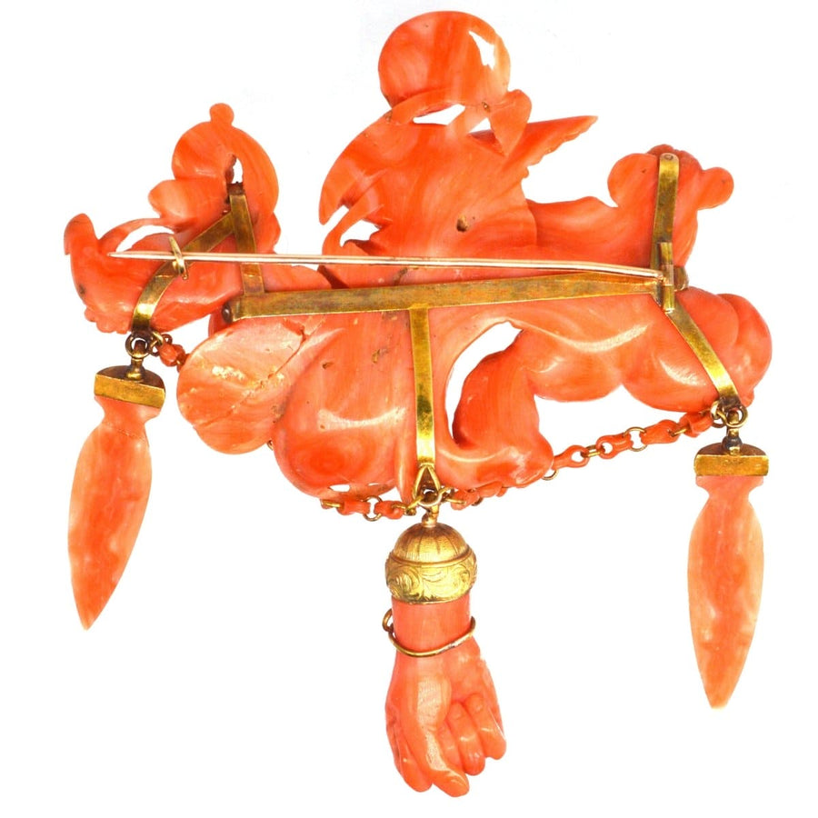 Large rare antique Italian carved coral brooch featuring goddess Hebe, Zeus, and Cupid, showcasing exquisite craftsmanship.