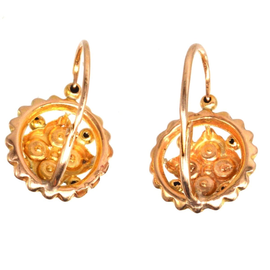 Late 19th century French gold dormeuses earrings with split pearl cluster, showcasing intricate design and elegance.