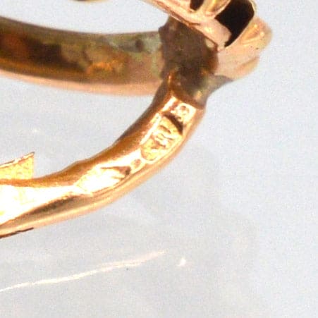 Detail of late 19th Century French gold dormeuse earring showcasing intricate craftsmanship and hallmark.