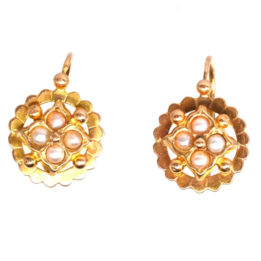 Late 19th Century French gold dormeuses earrings featuring split pearls, elegant vintage jewelry design from the 1880s.