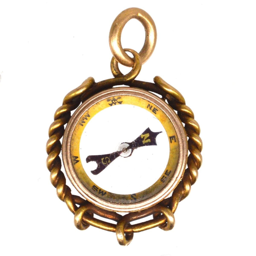 Late Victorian 9ct gold compass pendant charm with rope design, glass face, and spinning needle.