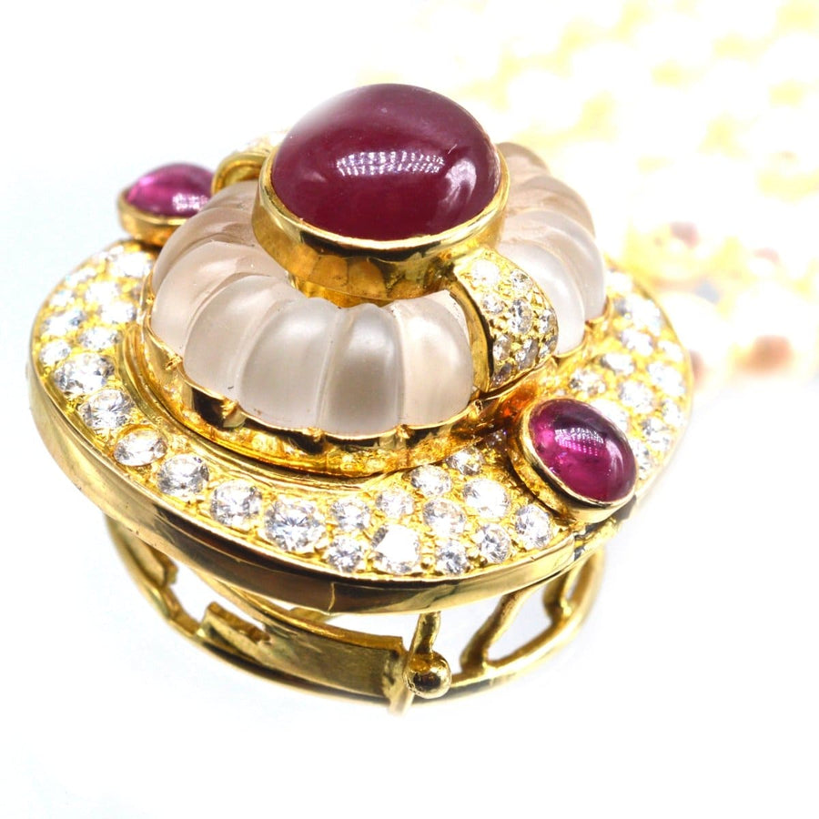 Elegant gold clasp with cabochon rubies, carved rock crystal, and diamonds for a pearl torsade necklace.
