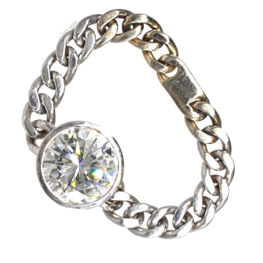Modern 18ct white gold ring with 1.8 carat brilliant cut diamond in bezel setting and flat curb chain design.