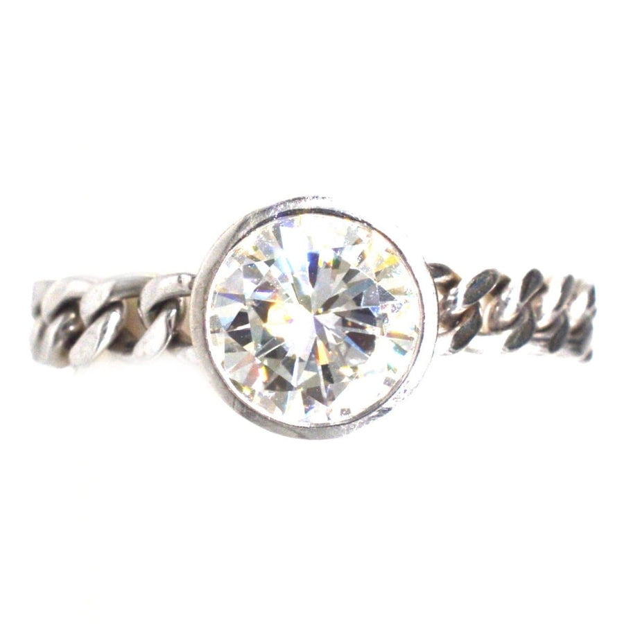 Modern 18ct white gold chain ring featuring a 1.8 carat brilliant cut diamond in bezel setting.