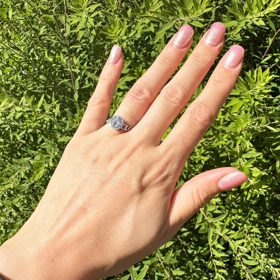 Hand showcasing a Modern 18ct White Gold Diamond Solitaire Chain Ring with a stunning 1.8 carat diamond.