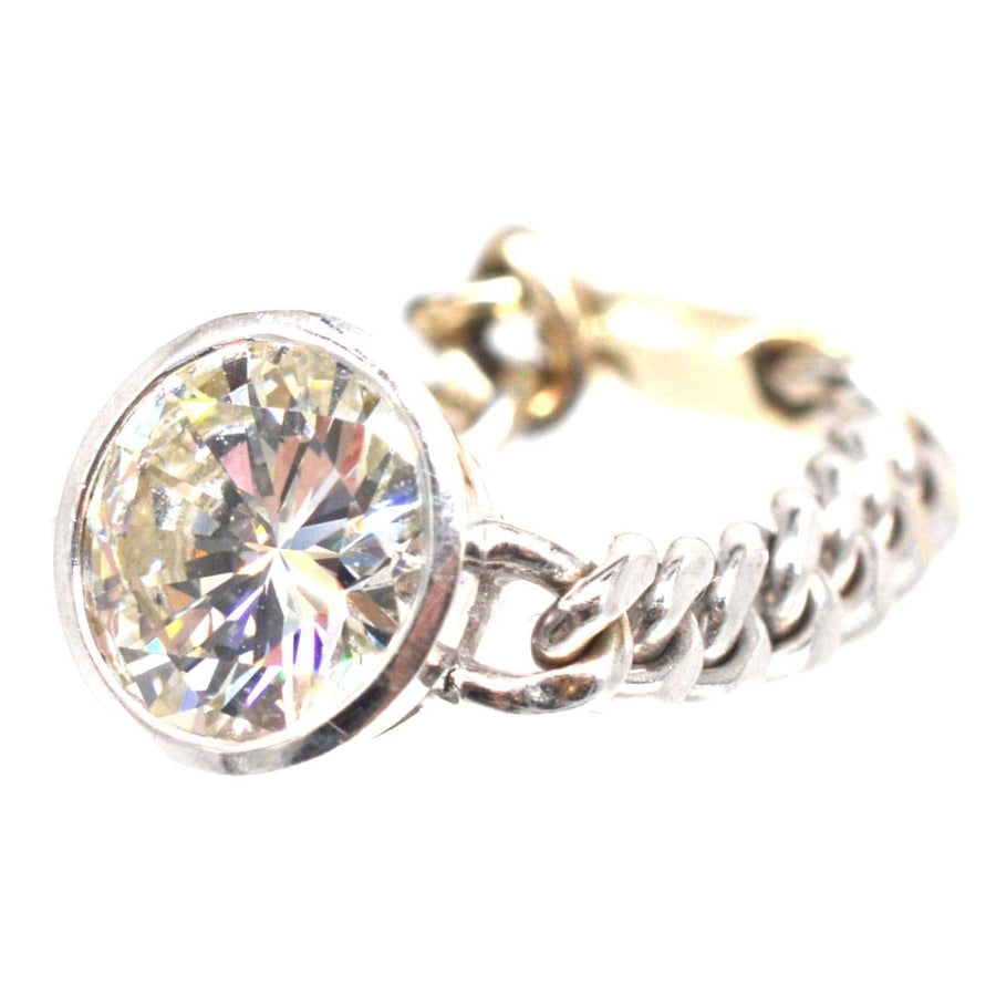 Modern 18ct white gold ring featuring a 1.8 carat brilliant cut diamond and unique flat curb chain design.