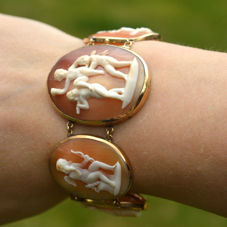 Regency 18ct gold bracelet with shell carved cameos of Cupid, showcasing romantic scenes from Roman mythology.