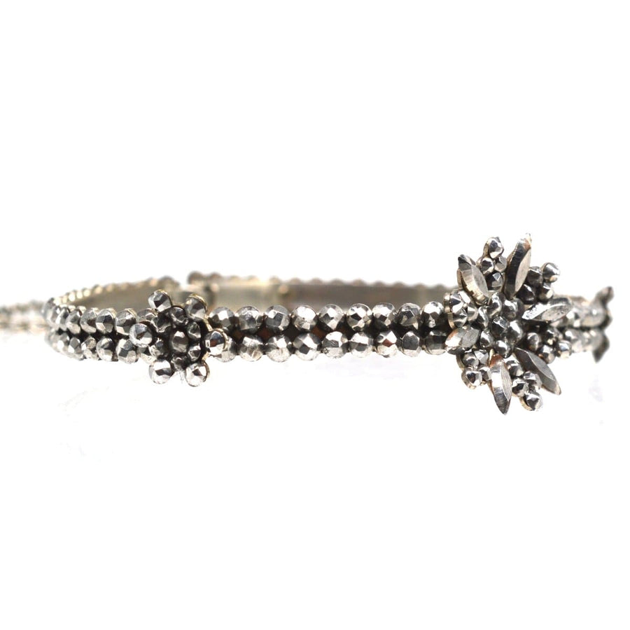 Regency Cut Steel Bangle featuring floral designs, showcasing elegant cut steel rose diamonds from the 19th century.