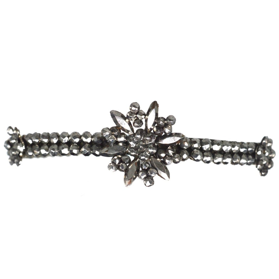 Regency Cut Steel Bangle featuring a central flower with two smaller flowers, showcasing cut steel rose diamonds.