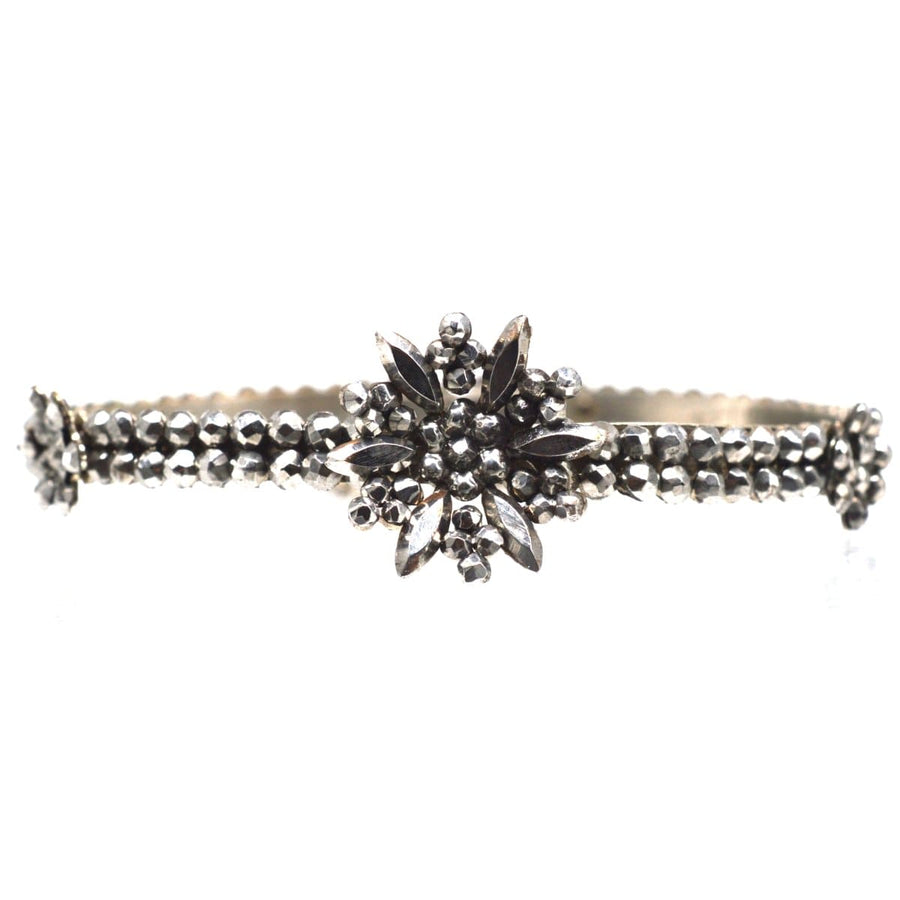 Regency Cut Steel Bangle featuring central flower design with smaller flowers, replicating rose diamonds craftsmanship.
