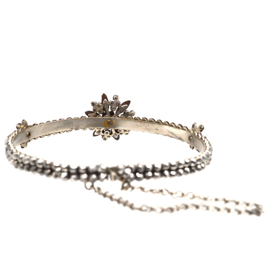 Regency Cut Steel Bangle with central flower and side flowers, showcasing cut steel rose diamond technique.