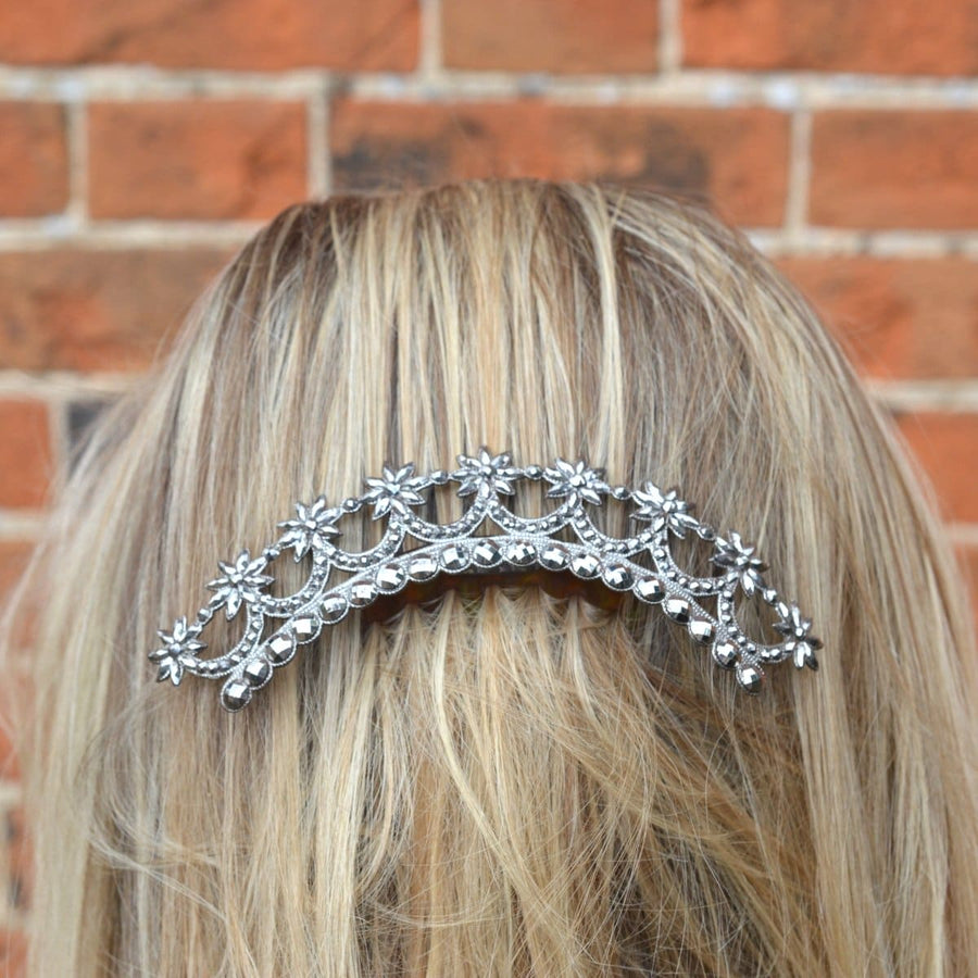 Georgian cut steel tiara with stars design, worn at the back of hair, showcasing exquisite craftsmanship.
