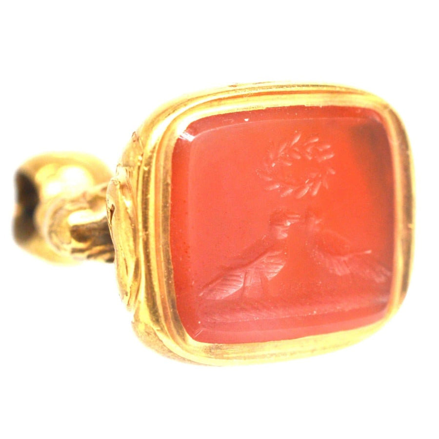 Regency gold cased seal showcasing carnelian intaglio of two doves kissing under a love wreath.