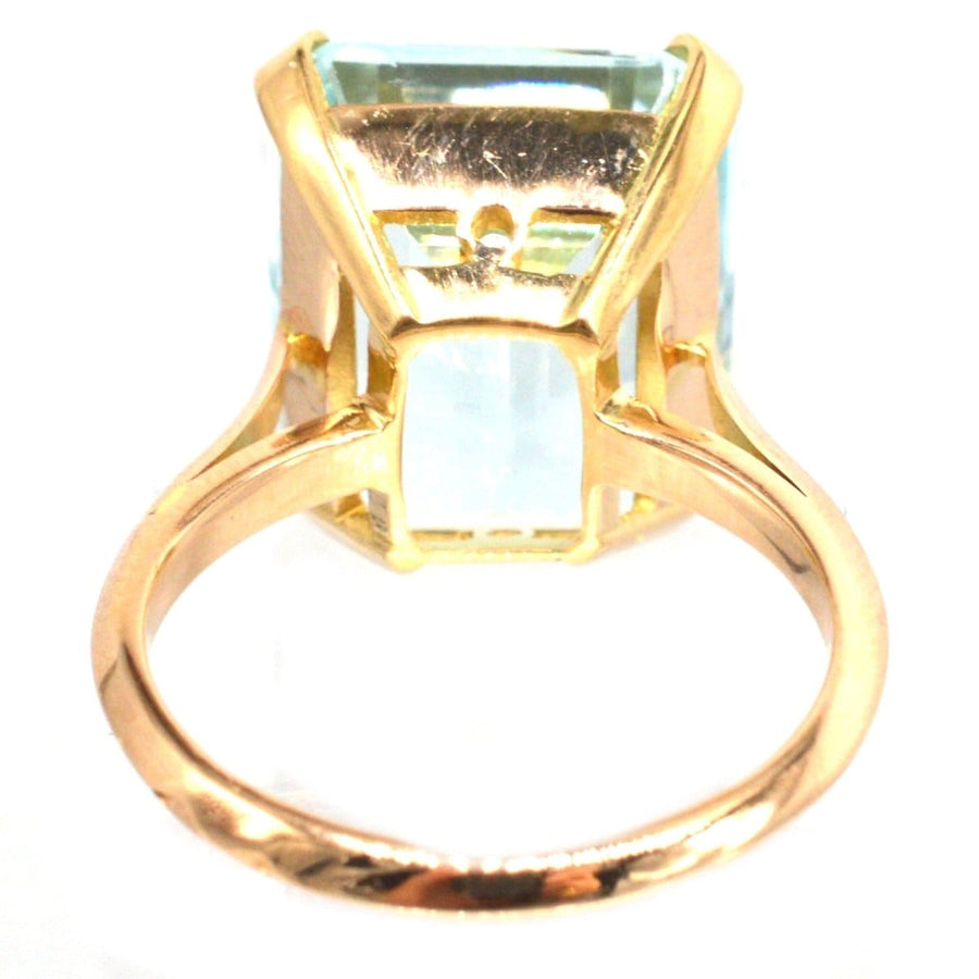 18ct gold aquamarine ring featuring a large 12 carat aquamarine in a simple elegant design.