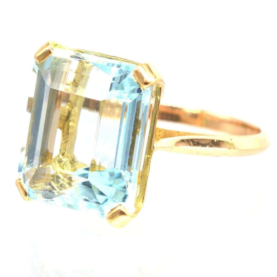Retro 18ct gold aquamarine ring featuring a stunning 12-carat aquamarine stone, perfect for engagement or March birthdays.