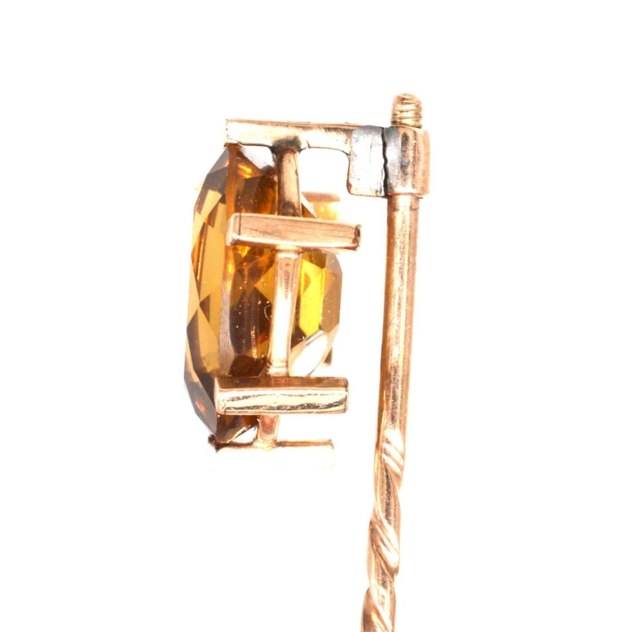 Close-up of retro 1940s 9ct gold tie pin featuring a stunning golden citrine stone in claw setting.