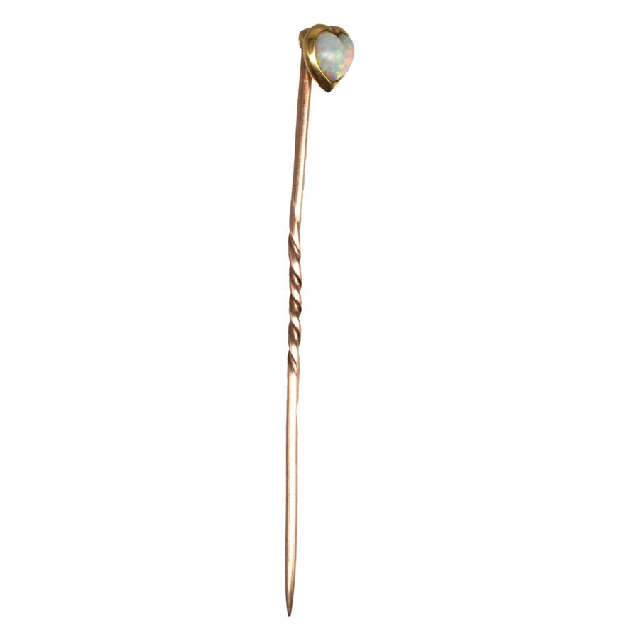 Small Edwardian 15ct gold tie pin with heart-shaped opal center, showcasing vibrant colors and romantic charm.