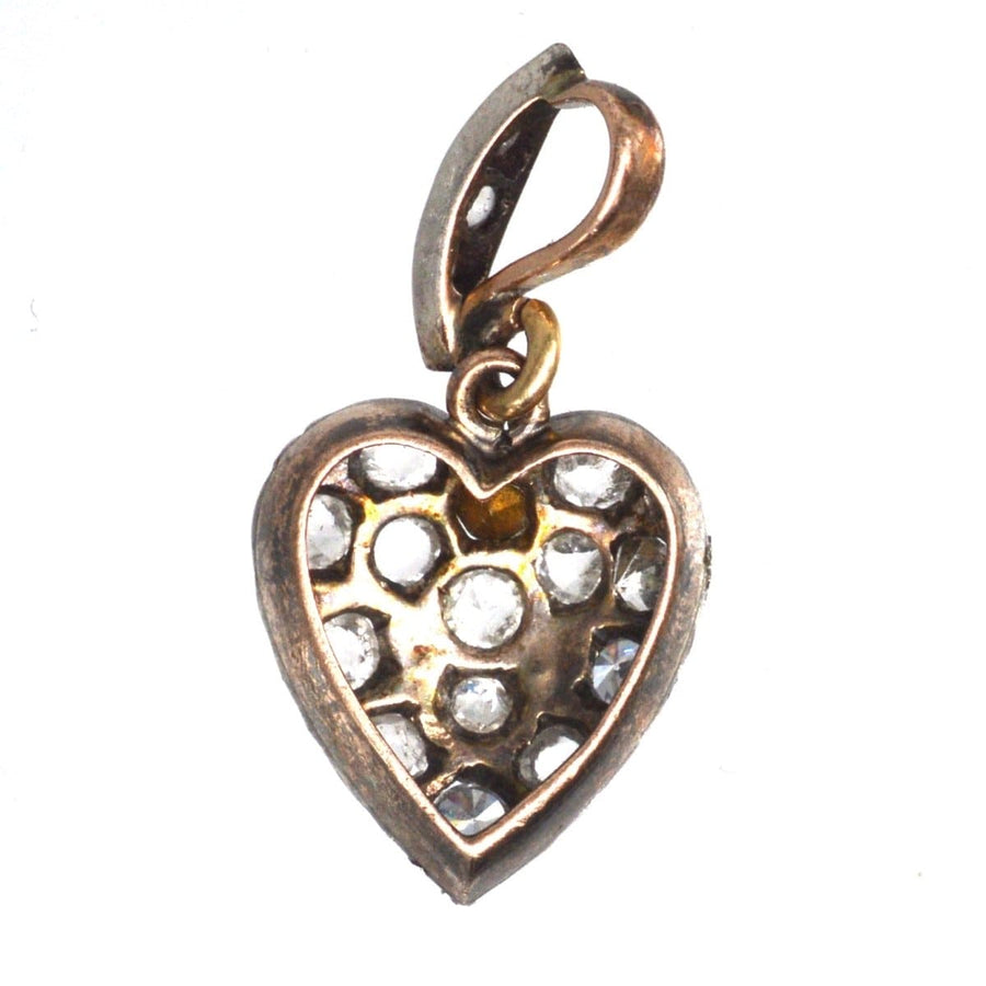 Small Edwardian gold and silver heart-shaped pendant set with paste from the early 1900s, perfect for romantic gifting.
