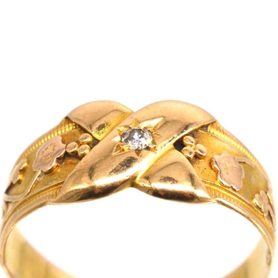 Victorian 18ct gold kiss ring with diamond and floral design, symbolizing love and new beginnings.