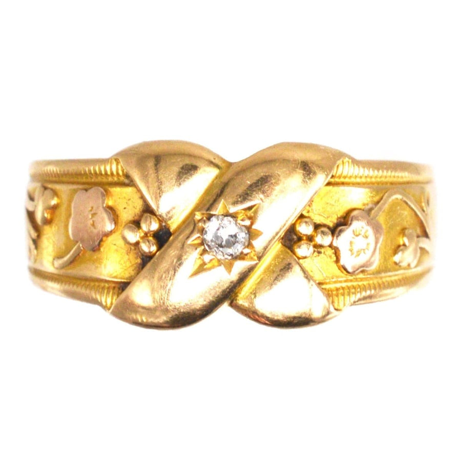 Victorian 18ct gold and diamond Kiss ring featuring floral designs representing love and new beginnings.