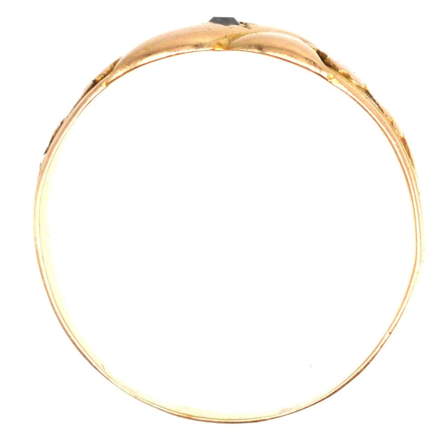 Victorian 18ct gold ring with 'kiss' design and floral shoulders, symbolizing love and new beginnings.