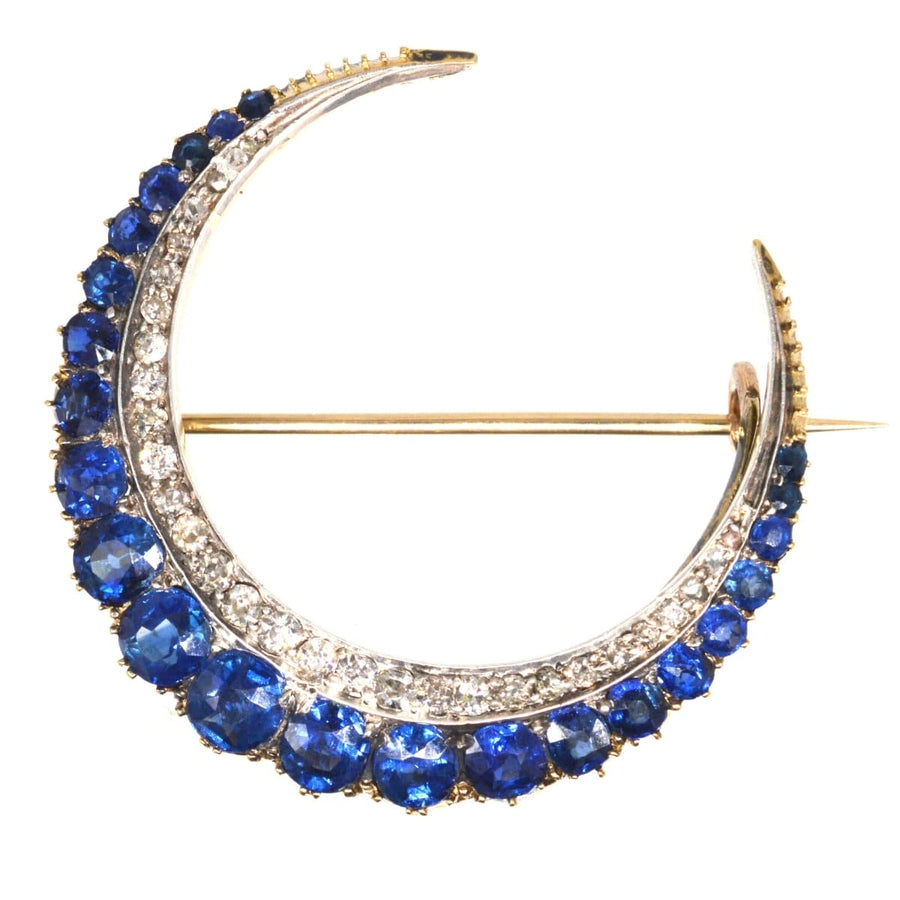 Victorian 18ct gold crescent moon brooch with sapphires and diamonds, symbolizing new beginnings.