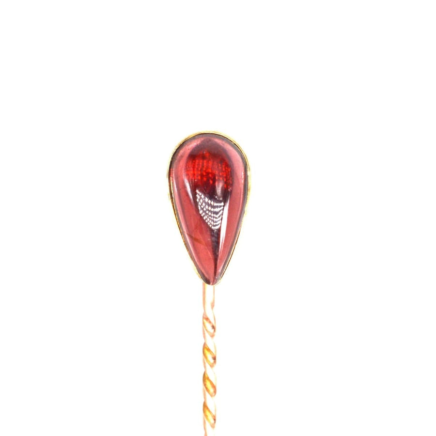 Victorian 9ct gold tie pin featuring a cabochon pear shaped garnet, made 1880-1900, perfect for January birthdays.